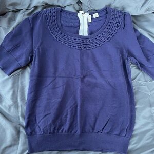 Cute braided boat collar with short sleeves and accent zipper on back.